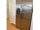 Stainless steel refrigerator with built-in ice maker and modern white cabinets at 1422 Spalding Rd, Winter Springs, FL 32708