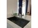 Modern kitchen featuring a stainless steel sink, faucet, and quartz countertops at 1422 Spalding Rd, Winter Springs, FL 32708