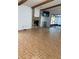Spacious living room with a fireplace, ceiling beams, and tile flooring at 1422 Spalding Rd, Winter Springs, FL 32708