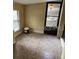 Bright sunroom featuring tile flooring, a storm door and window, and neutral color palette at 1422 Spalding Rd, Winter Springs, FL 32708