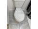 White toilet with tile flooring in a clean bathroom setting at 1422 Spalding Rd, Winter Springs, FL 32708