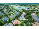 Scenic aerial view showcases houses surrounded by mature trees, serene lakes, and well-maintained green spaces in a beautiful community at 1453 Langham Ter, Lake Mary, FL 32746