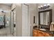 Cozy bathroom with granite-topped vanity and views into bedroom and hall at 1453 Langham Ter, Lake Mary, FL 32746