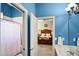 Bathroom with a shower and view into bedroom at 1453 Langham Ter, Lake Mary, FL 32746