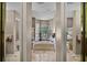 Bright bathroom with a soaking tub under a large window at 1453 Langham Ter, Lake Mary, FL 32746