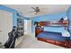 Large bedroom with a ceiling fan, a bunkbed, and neutral carpet flooring at 1453 Langham Ter, Lake Mary, FL 32746