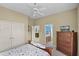 Bright bedroom with a ceiling fan, a closet, and an ensuite bathroom at 1453 Langham Ter, Lake Mary, FL 32746