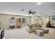 Spacious bonus room with a ceiling fan, plenty of natural light, and carpet flooring at 1453 Langham Ter, Lake Mary, FL 32746