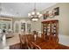 Formal dining area features an expansive table and access to the formal living area at 1453 Langham Ter, Lake Mary, FL 32746