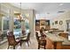 Open-concept kitchen with island seating, breakfast nook, and backyard pool access at 1453 Langham Ter, Lake Mary, FL 32746