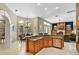 Spacious kitchen with island, breakfast nook, and fireplace in the adjacent Gathering room at 1453 Langham Ter, Lake Mary, FL 32746