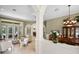 Open-concept living area with views to the pool and dining room at 1453 Langham Ter, Lake Mary, FL 32746