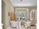 Comfortable living room featuring french doors with outdoor access, neutral tones and tile floors at 1453 Langham Ter, Lake Mary, FL 32746