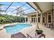 Relaxing screened-in pool area with outdoor seating and lush landscaping at 1453 Langham Ter, Lake Mary, FL 32746