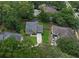 A captivating aerial view of the home nestled among lush trees at 1610 Owl Ridge Ct, Apopka, FL 32712