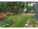 Spacious backyard features a new fence and well-maintained lawn, creating an inviting outdoor space at 1610 Owl Ridge Ct, Apopka, FL 32712