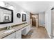 Spacious bathroom with double sinks, granite countertops, and a glass shower at 1610 Owl Ridge Ct, Apopka, FL 32712