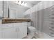 Clean bathroom with a granite countertop, white cabinets, and a shower curtain at 1610 Owl Ridge Ct, Apopka, FL 32712