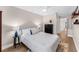 Bright bedroom with a black dresser, hardwood floors, and a walk-in closet at 1610 Owl Ridge Ct, Apopka, FL 32712
