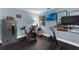 Well-equipped home gym with exercise equipment, rubber flooring, mounted TVs, and motivational decor at 1610 Owl Ridge Ct, Apopka, FL 32712