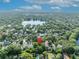 Overhead shot exhibiting verdant neighborhood with beautiful houses and a serene lake nearby at 171 Cortland Ave, Winter Park, FL 32789