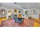 Spacious living room featuring a fireplace, hardwood floors, and built-in bookshelves at 171 Cortland Ave, Winter Park, FL 32789