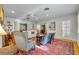 Bright living room featuring hardwood floors and built-in bookshelves at 171 Cortland Ave, Winter Park, FL 32789