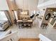 Open-concept dining area featuring views of the kitchen and living room at 1803 Meadow Pond Way, Orlando, FL 32824