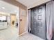 Home entrance leading to a kitchen and living room with tile floors at 1803 Meadow Pond Way, Orlando, FL 32824