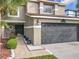 Home featuring a well-manicured lawn, easy access walkway and a two-car garage at 1803 Meadow Pond Way, Orlando, FL 32824