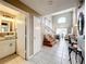 Bright foyer featuring tile floors, staircase, and an open view to the living room at 1803 Meadow Pond Way, Orlando, FL 32824