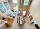 Aerial view of open living and dining areas featuring soaring ceilings and natural light at 1803 Meadow Pond Way, Orlando, FL 32824