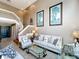 Inviting living room featuring soaring ceilings, stylish decor, and staircase access at 1803 Meadow Pond Way, Orlando, FL 32824
