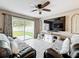 Bright living room with sliding glass door, white trim and comfortable seating at 1803 Meadow Pond Way, Orlando, FL 32824