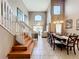 Open-concept living space features high ceilings, lots of light, and seamless flow to the dining area at 1803 Meadow Pond Way, Orlando, FL 32824