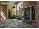 Inviting front entrance with modern door, brick exterior, and paver stones at 20 Twelve Oaks Trl, Ormond Beach, FL 32174