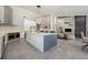 Open kitchen featuring a large island, modern appliances, and a seamless transition to the living area at 20 Twelve Oaks Trl, Ormond Beach, FL 32174