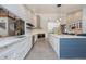 Well-equipped kitchen with a large island, modern fixtures, and stainless steel appliances at 20 Twelve Oaks Trl, Ormond Beach, FL 32174