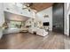 Bright, open living room featuring high ceilings, modern fireplace, and wood floors at 20 Twelve Oaks Trl, Ormond Beach, FL 32174