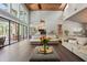 Open-concept living area with hardwood floors, high ceilings, and an abundance of natural light at 20 Twelve Oaks Trl, Ormond Beach, FL 32174