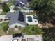 Aerial view of the home showcasing the private pool, gazebo, solar panels, and lush landscaping at 2122 Palm Crest Dr, Apopka, FL 32712