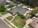 Aerial view of a single-Gathering home featuring a private pool, well-manicured lawn, and mature landscaping at 2122 Palm Crest Dr, Apopka, FL 32712