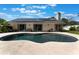 Private pool, outdoor patio, solar panels, and well-maintained landscaping make this backyard a dream at 2122 Palm Crest Dr, Apopka, FL 32712