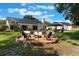 Beautiful backyard with fire pit, seating area, gazebo, and well maintained lawn, great for outdoor entertainment at 2122 Palm Crest Dr, Apopka, FL 32712