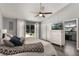 Serene main bedroom with an ensuite bathroom, sliding glass doors to the backyard, and a ceiling fan at 2122 Palm Crest Dr, Apopka, FL 32712