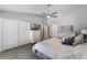 Bedroom with hardwood floors, a ceiling fan, closet, and dresser with drawers at 2122 Palm Crest Dr, Apopka, FL 32712