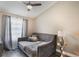 This bedroom boasts a comfortable daybed and a side table with stylish decor at 2122 Palm Crest Dr, Apopka, FL 32712