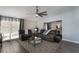 Comfortable living room featuring reclining seating, modern decor, and lots of natural light from the adjacent windows at 2122 Palm Crest Dr, Apopka, FL 32712