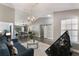 Bright living room showcasing open floor plan with dining area, modern chandelier, and sliding barn door at 2122 Palm Crest Dr, Apopka, FL 32712