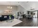 Open-concept living and dining area with hardwood floors, vaulted ceilings, and stylish contemporary decor at 2122 Palm Crest Dr, Apopka, FL 32712